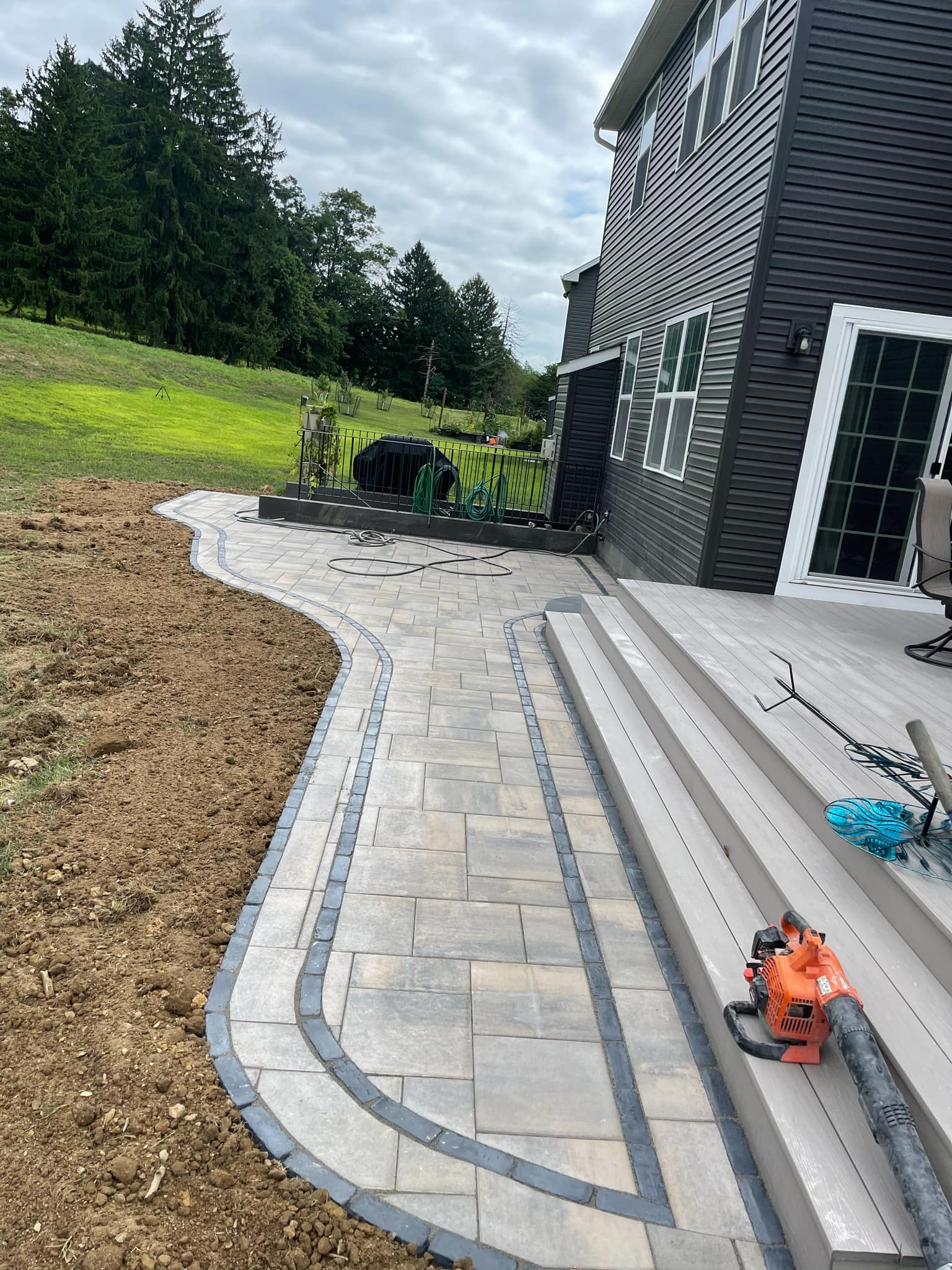 Backyard landscape and outdoor improvement area